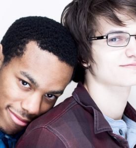 Happy and smiling interracial gay couple A happy and attractive interracial gay couple.
